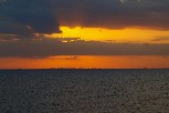Miami skyline against a setting sun